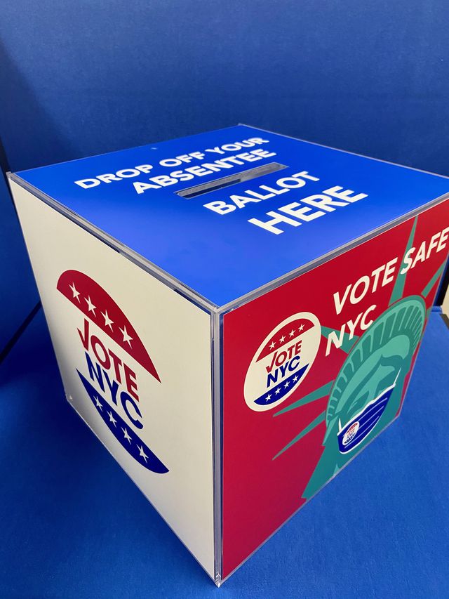 A secure absentee ballot box that has a graphic of the Statue of Libery wearing a NYC Votes mask